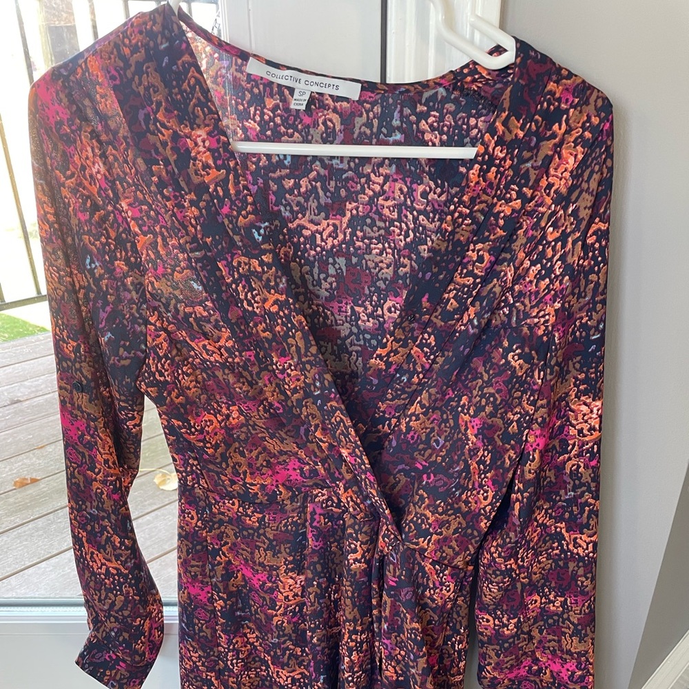 Small petite long sleeve Collective Concepts romper.